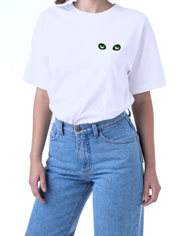 Green Cat Eyes on a White T-Shirt