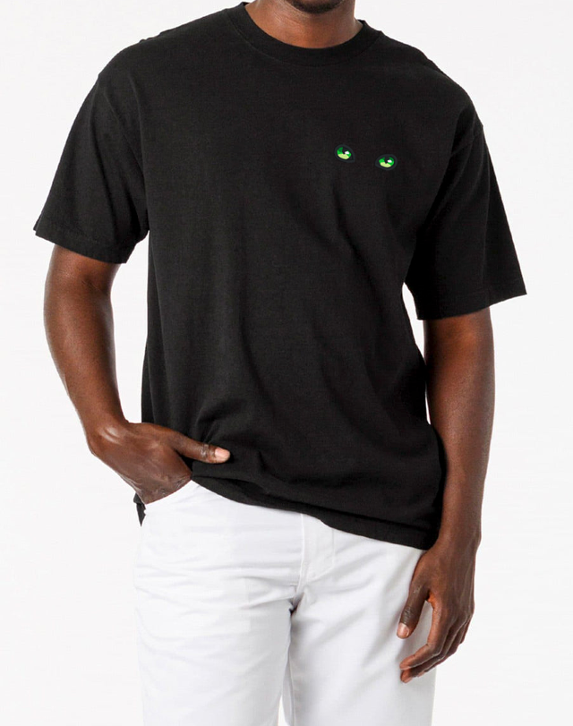 Green Cat Eyes on a Black T-Shirt